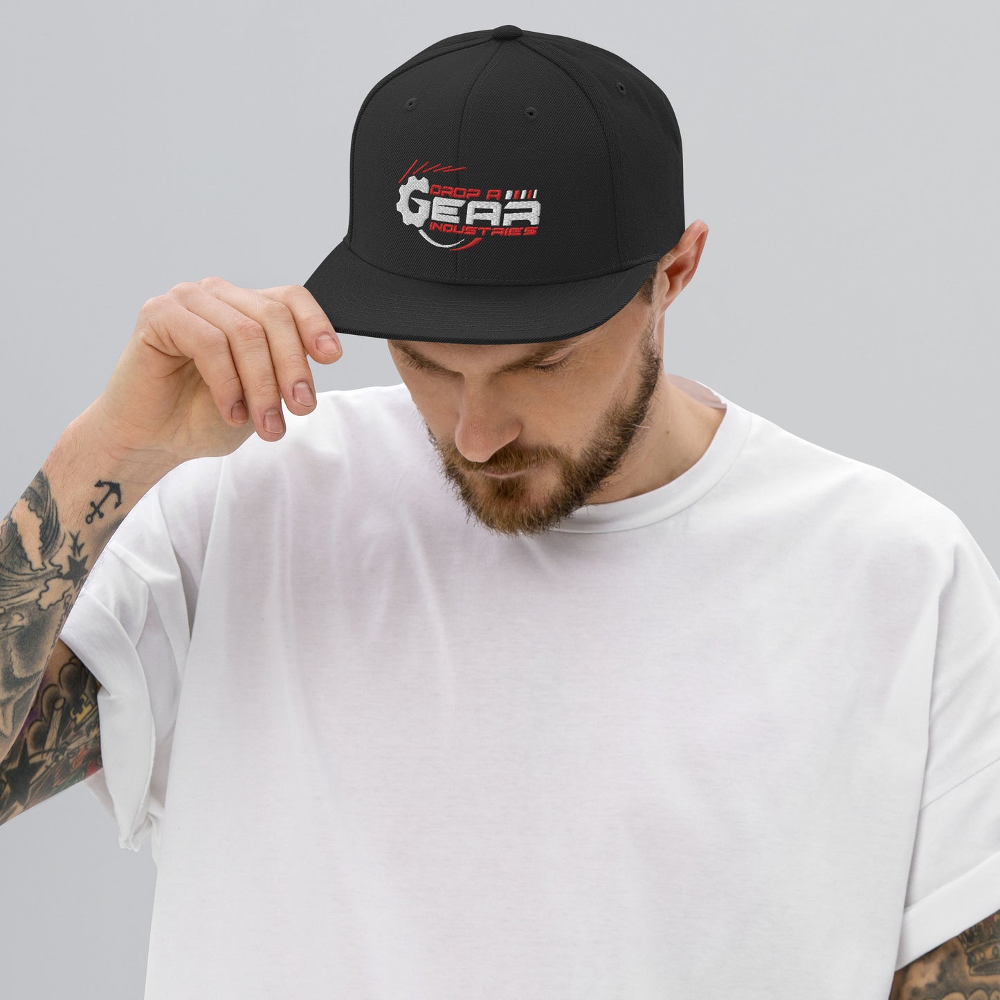 Drop A Gear logo Snapback Hat in dark colors